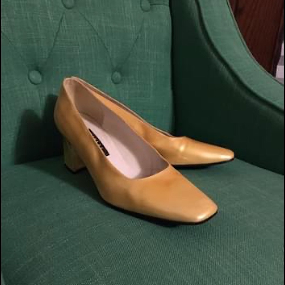 Stuart Weitzman square heeled pumps.